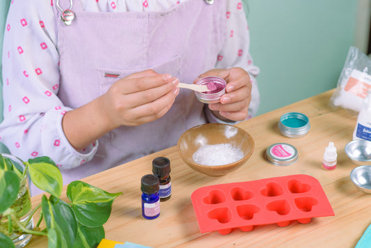 Girl making her own bath bombs with a DIY kit