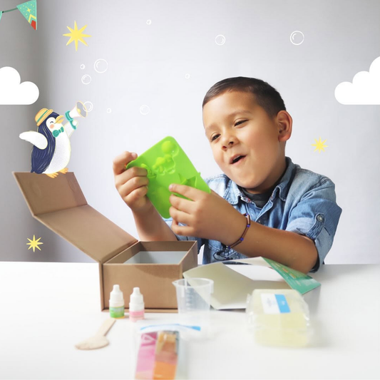 Boy holding a fun-shaped silicone soap mould